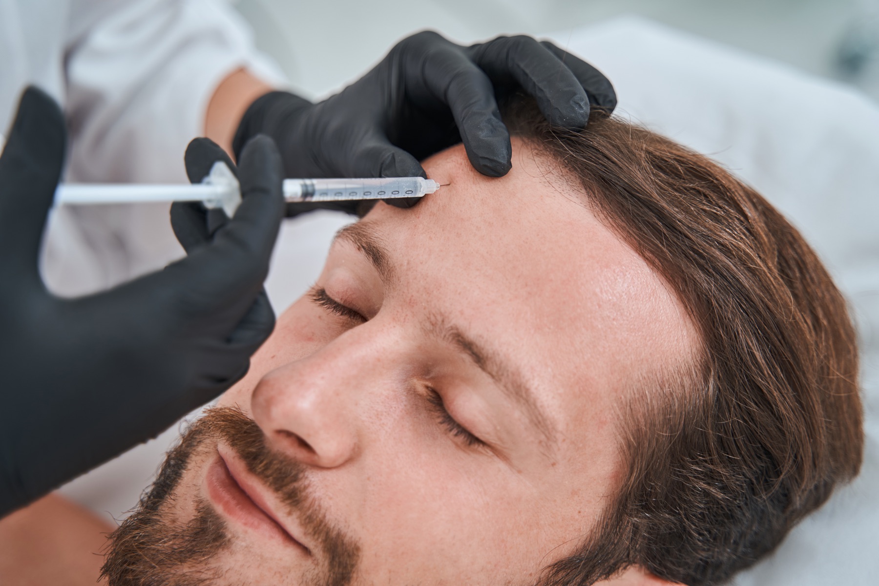 Aesthetic treatment for a man at the clinic